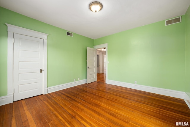 unfurnished bedroom featuring hardwood / wood-style floors