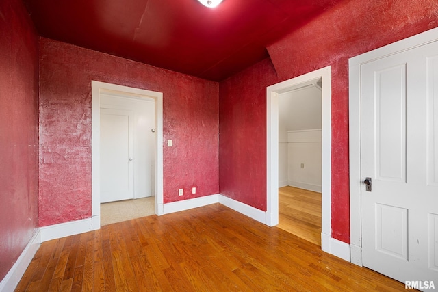 spare room with wood-type flooring