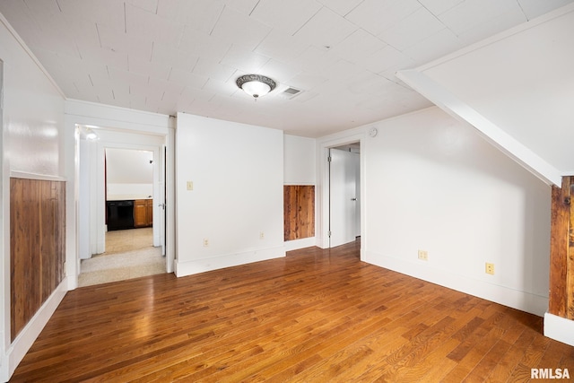 additional living space featuring hardwood / wood-style floors