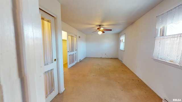 unfurnished room with ceiling fan