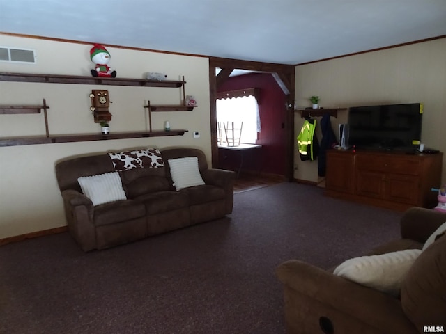 living room featuring crown molding and dark carpet