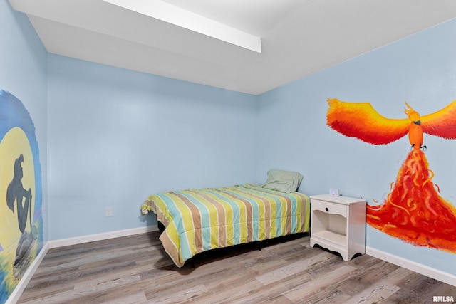 bedroom featuring hardwood / wood-style floors