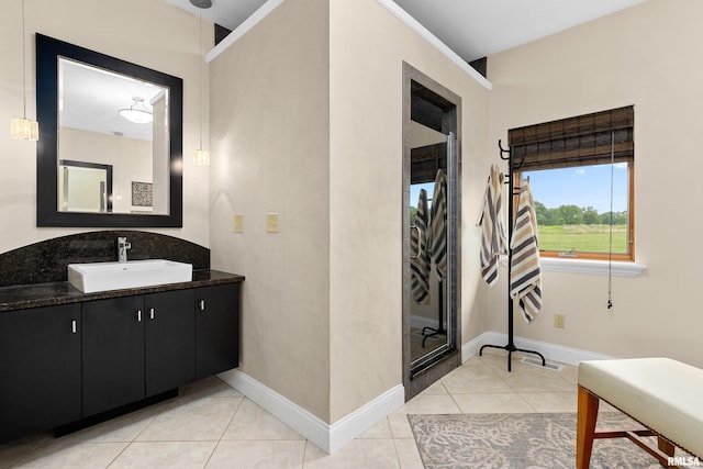 bathroom with vanity and tile patterned flooring