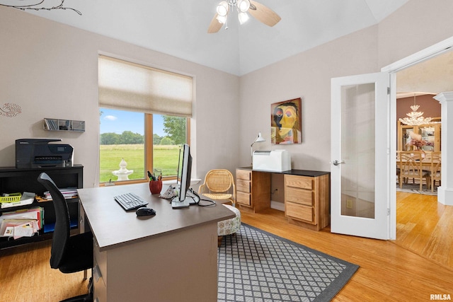 office space featuring vaulted ceiling, ceiling fan, hardwood / wood-style floors, and french doors