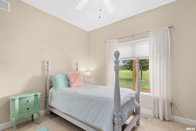 bedroom with light colored carpet and ceiling fan