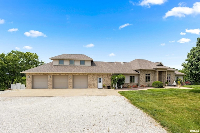 view of front of property with a garage and a front yard