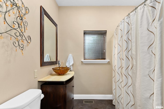 bathroom with vanity and toilet