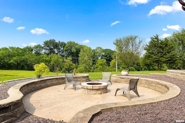 view of patio / terrace with an outdoor fire pit