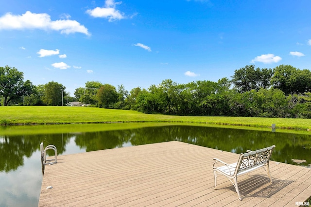 dock area with a water view and a lawn