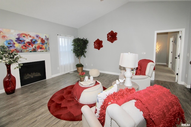 living room with vaulted ceiling and dark hardwood / wood-style floors