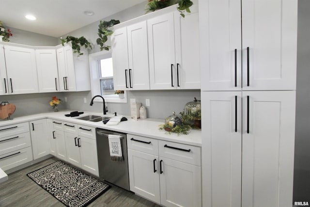 kitchen with white cabinets, sink, and dishwasher