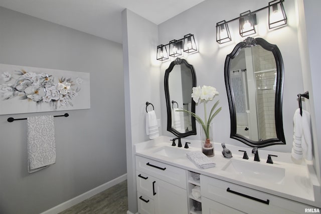 bathroom with vanity and hardwood / wood-style floors