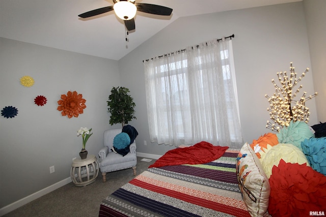 carpeted bedroom with ceiling fan and lofted ceiling