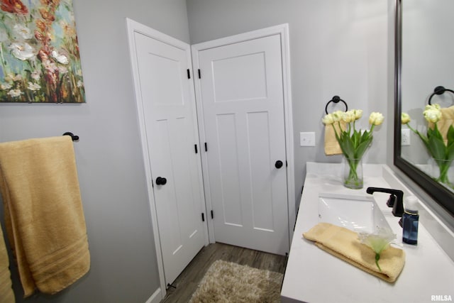 bathroom with vanity and hardwood / wood-style floors