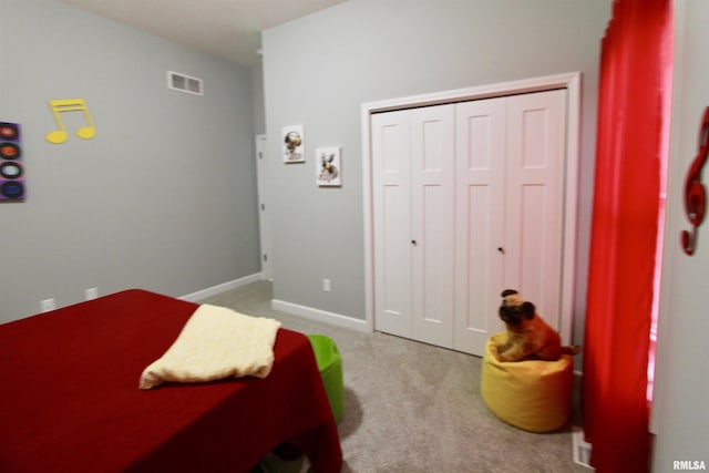 carpeted bedroom with a closet