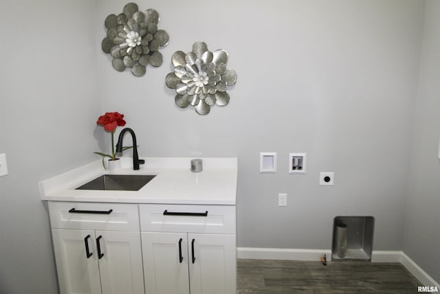 laundry area with dark wood-type flooring, washer hookup, sink, and electric dryer hookup