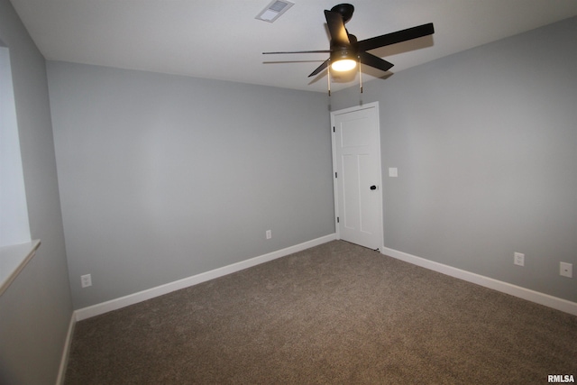 spare room with ceiling fan and carpet flooring