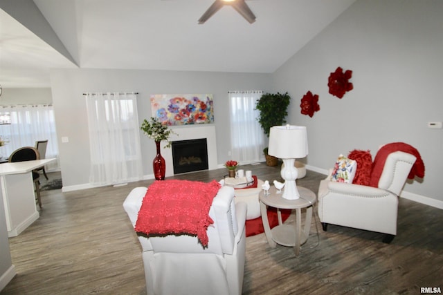 living room featuring lofted ceiling, dark hardwood / wood-style flooring, and plenty of natural light