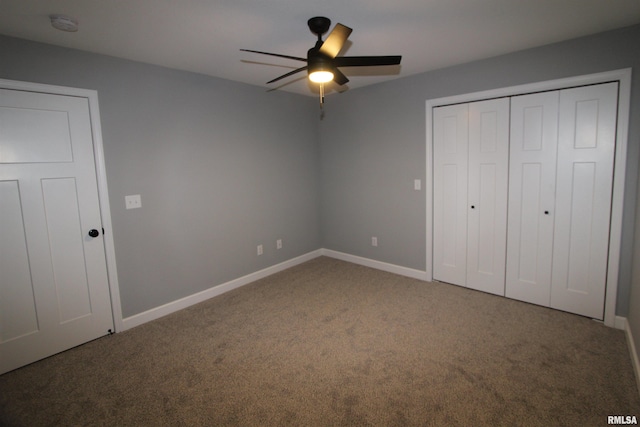 unfurnished bedroom with carpet flooring, ceiling fan, and a closet