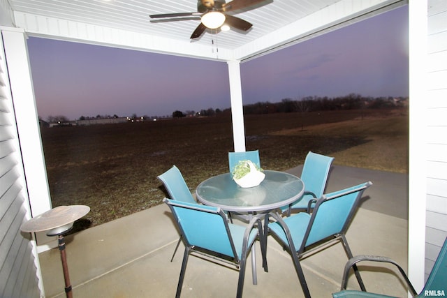 patio terrace at dusk with ceiling fan