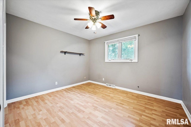 empty room featuring ceiling fan and light hardwood / wood-style floors