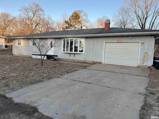 back of property featuring a garage