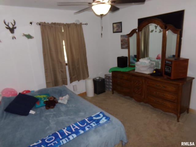 bedroom with ceiling fan and carpet