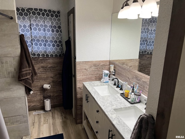 bathroom featuring vanity and hardwood / wood-style floors