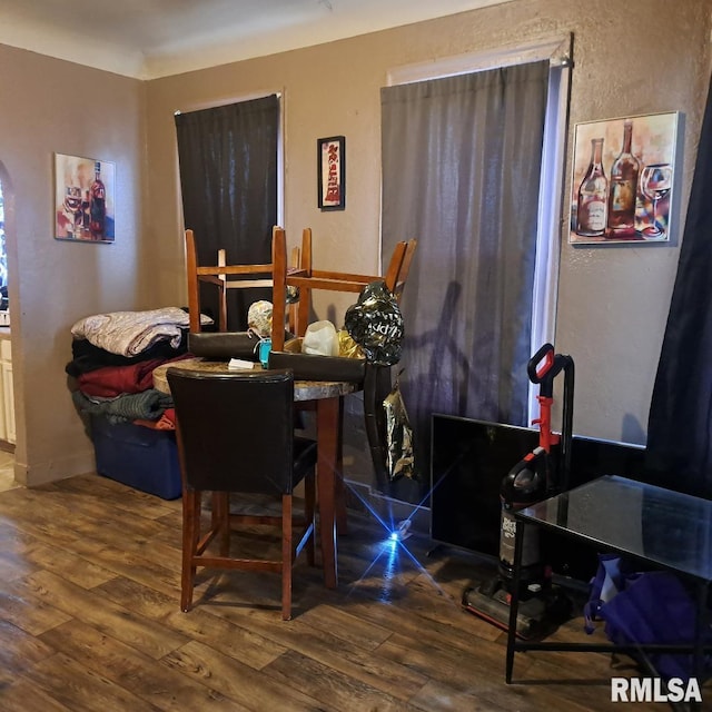 dining area with wood-type flooring