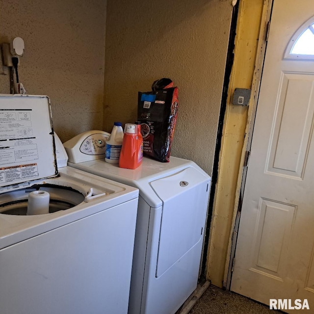 clothes washing area featuring independent washer and dryer