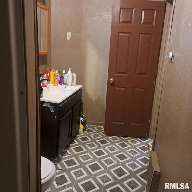 bathroom with vanity and toilet