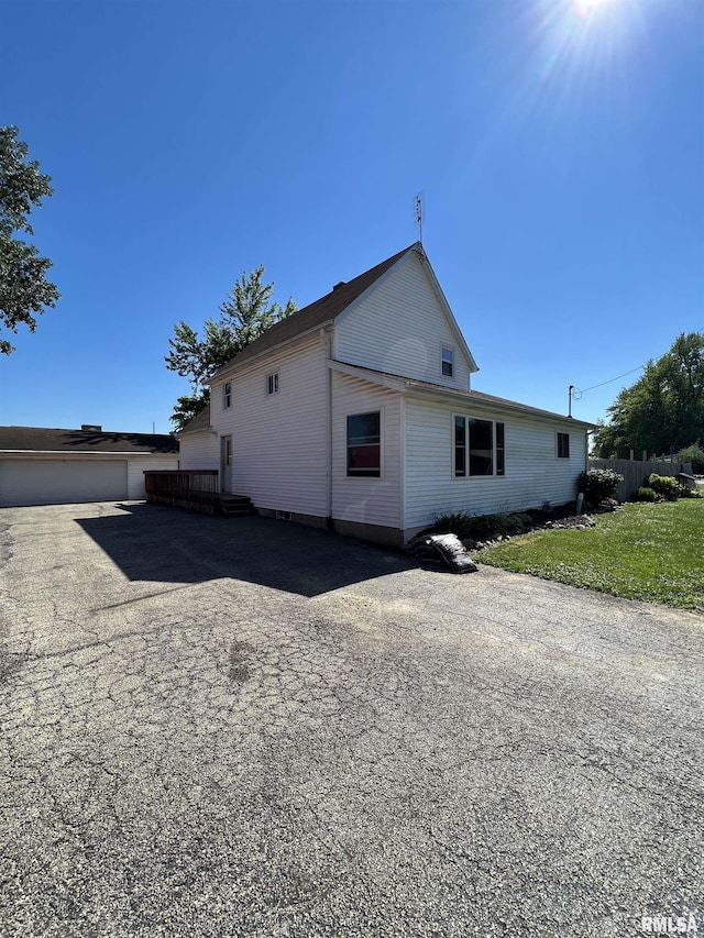 view of property exterior featuring a garage