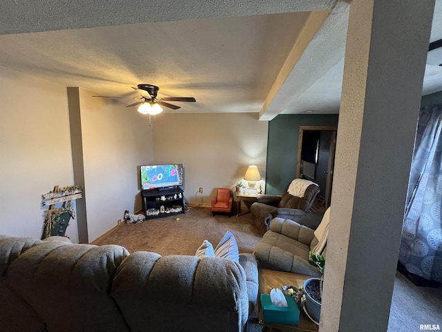 carpeted living room with ceiling fan and a textured ceiling