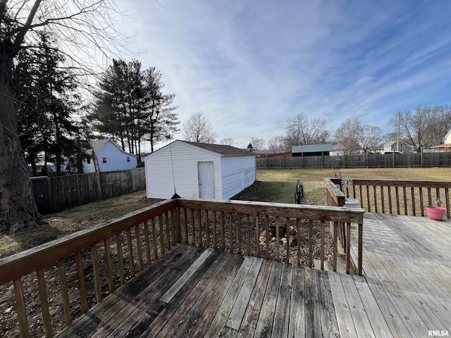 deck with a storage unit and a lawn