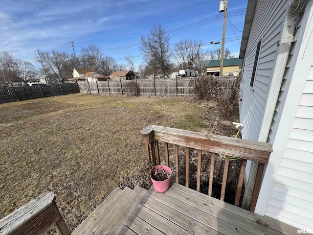 wooden deck with a lawn