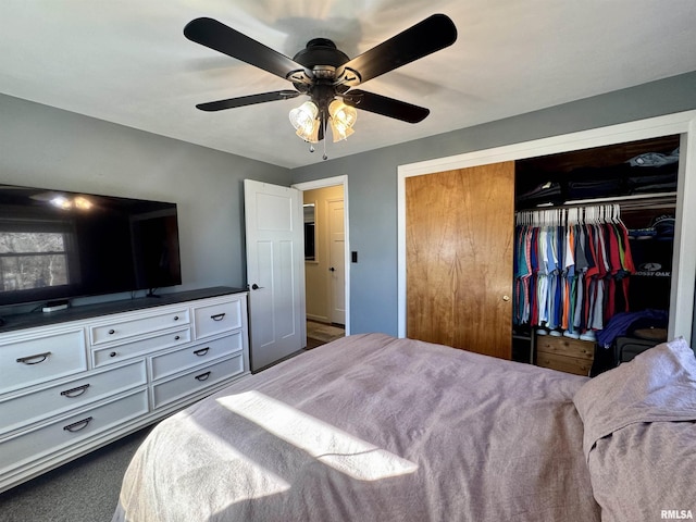 bedroom featuring dark carpet, a closet, and ceiling fan