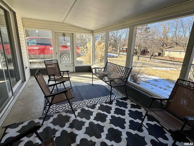 sunroom / solarium with vaulted ceiling