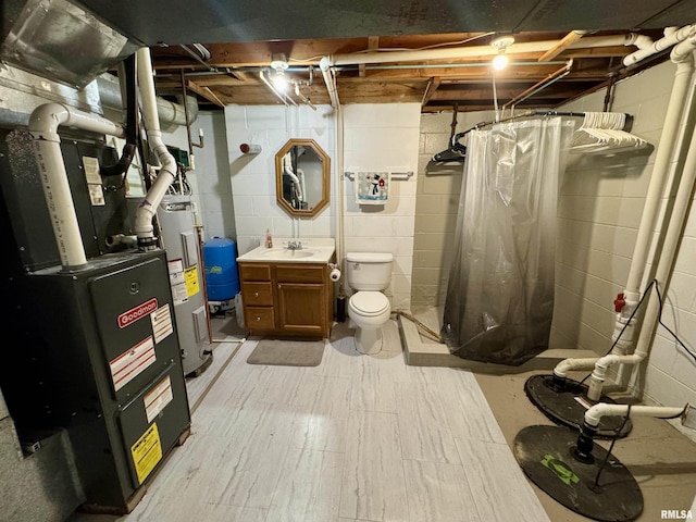 interior space with electric water heater, sink, light wood-type flooring, and heating unit