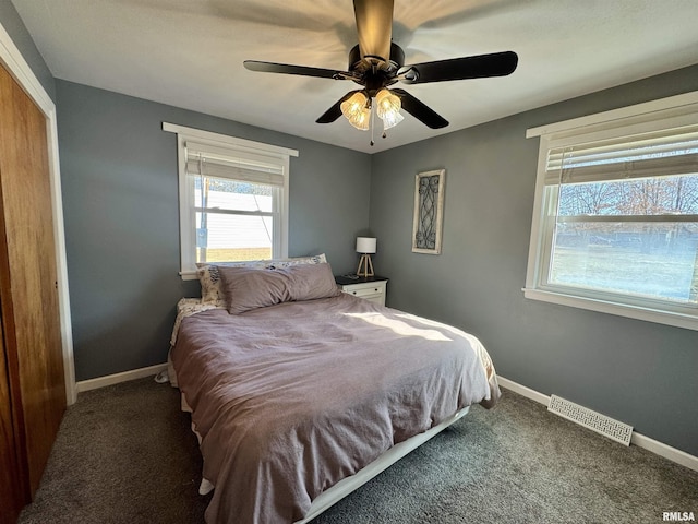 carpeted bedroom featuring ceiling fan