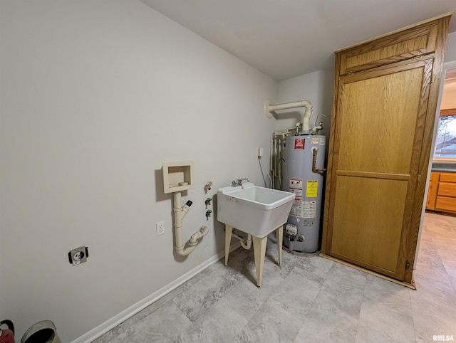 washroom featuring electric dryer hookup, sink, and gas water heater