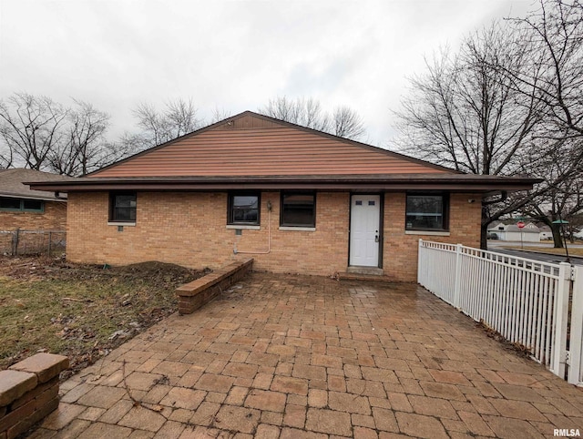 view of front of property featuring a patio