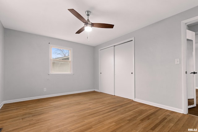 unfurnished bedroom featuring a closet, ceiling fan, and light hardwood / wood-style flooring