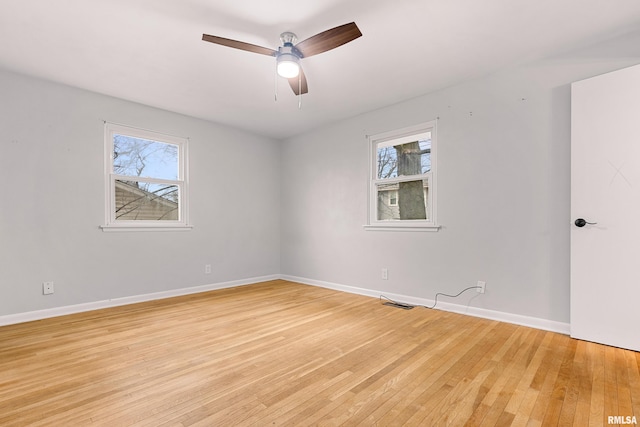 unfurnished room with ceiling fan and light wood-type flooring