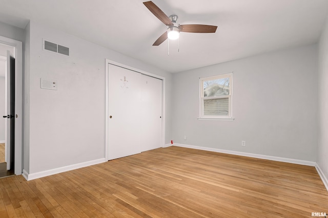 unfurnished bedroom with a closet, ceiling fan, and light wood-type flooring