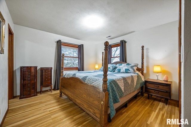 bedroom with light hardwood / wood-style flooring