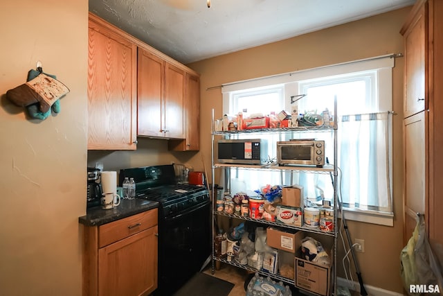 kitchen with black gas range oven