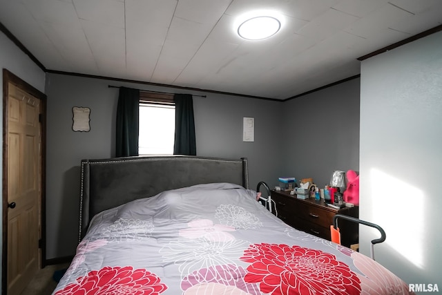 bedroom with ornamental molding