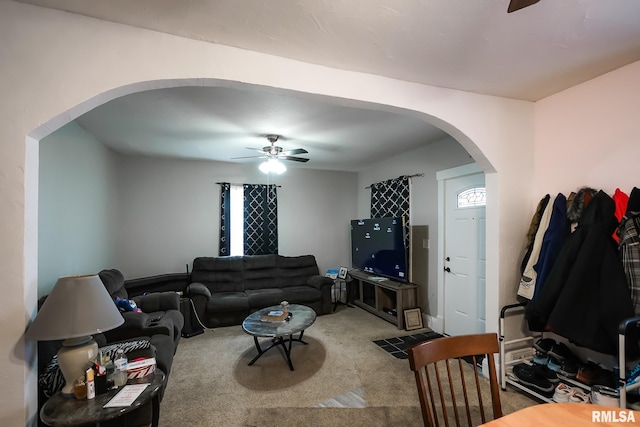 living room with carpet floors and ceiling fan