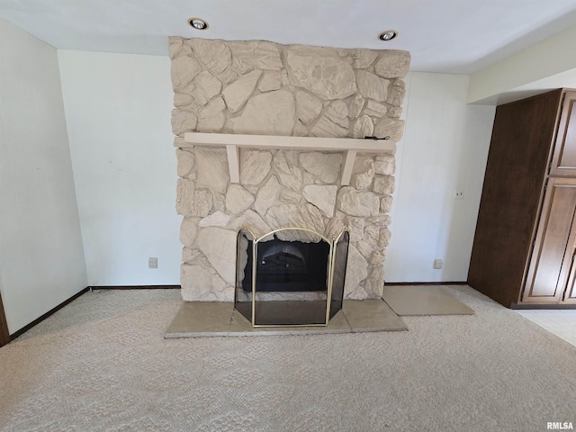 room details with carpet and a fireplace