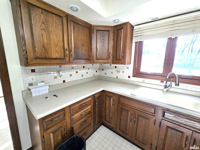 kitchen with tasteful backsplash and sink